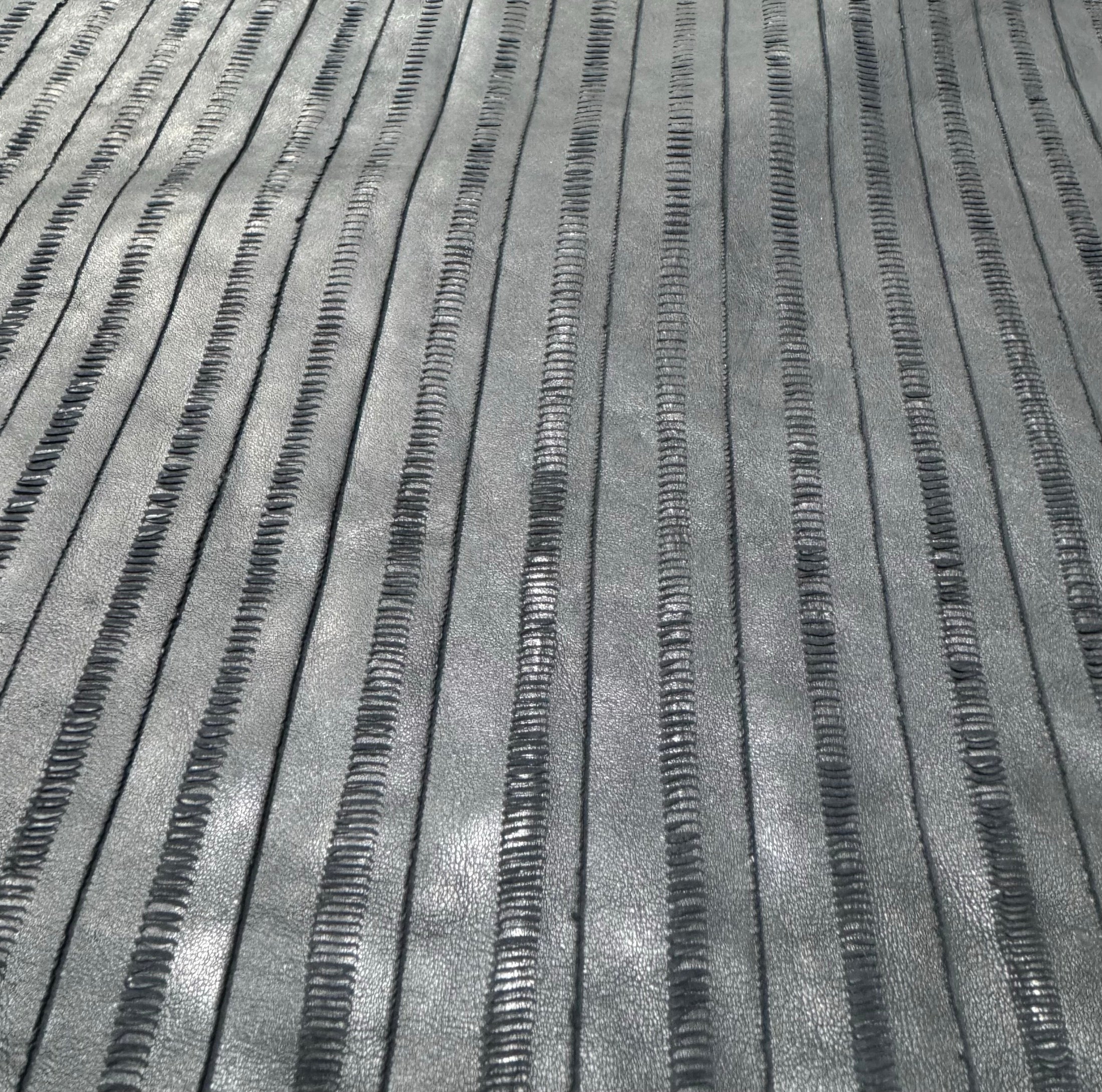 ET-01 Eel Track cutline leather with eel stitch inspired linear texture
